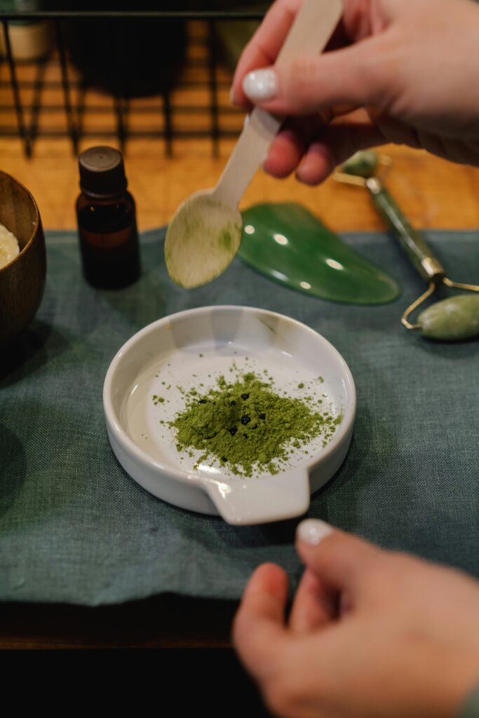 A person blends herbal powder for skincare treatment indoors. acid reflux in dogs home remedy