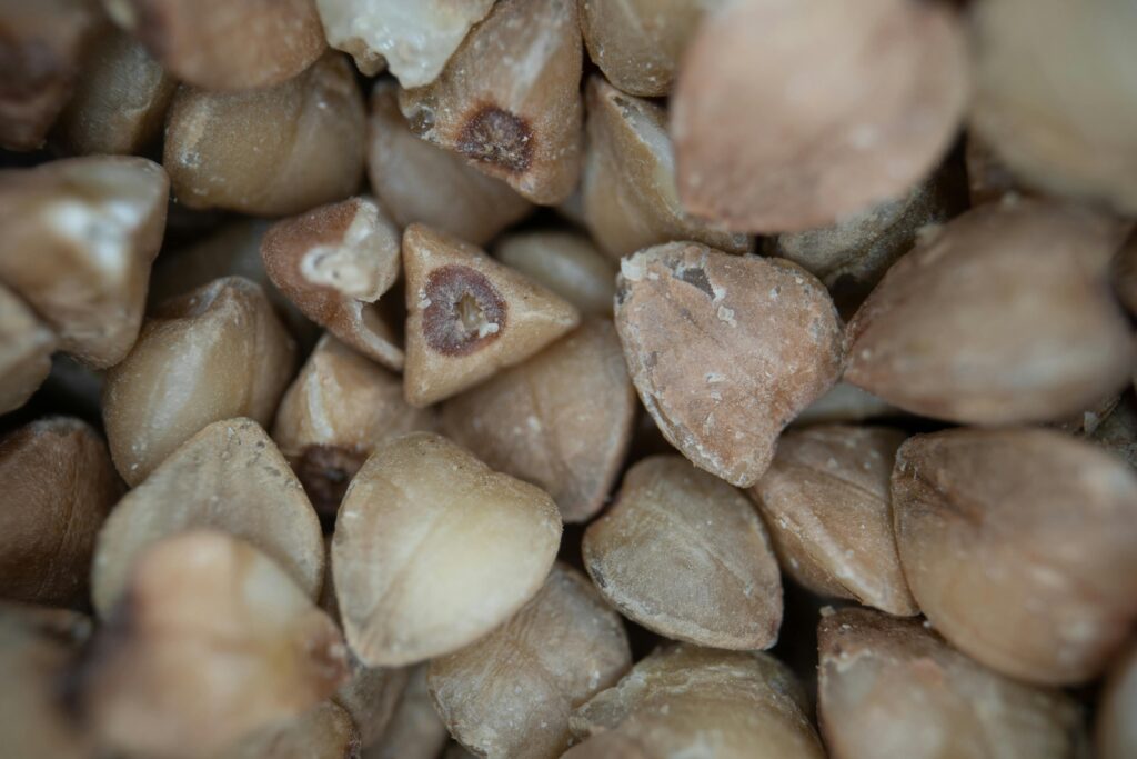 Close-up macro image of raw buckwheat seeds showcasing texture and detail.